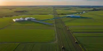 Aerial view of modern agricultural fields with advanced farming technology in the US, illustrating increased crop yields.